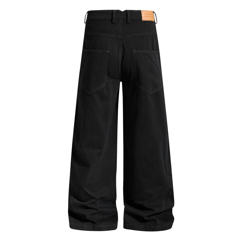 Black pants back view with cargo pockets, belt loops, and tan leather patch at waistband
