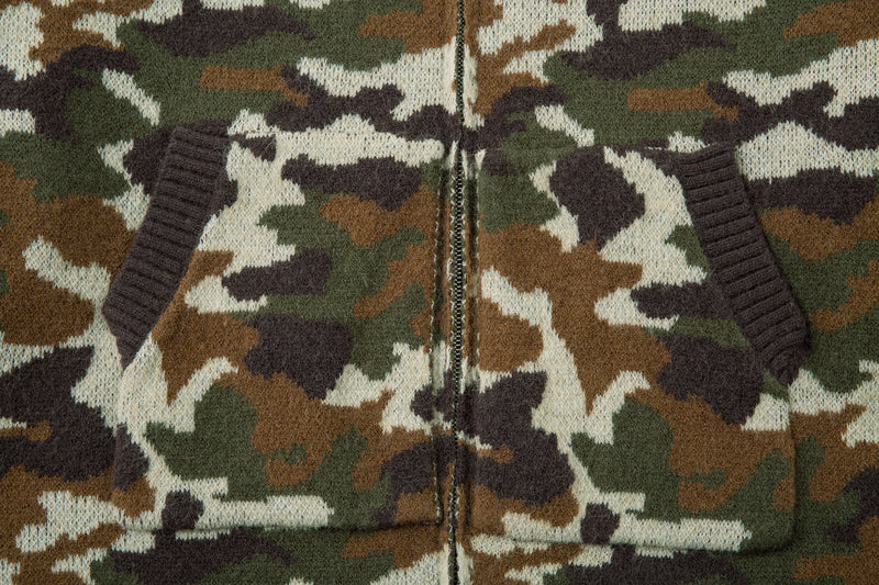 Front view close-up of camouflage knit zip-up hoodie with ribbed pocket openings