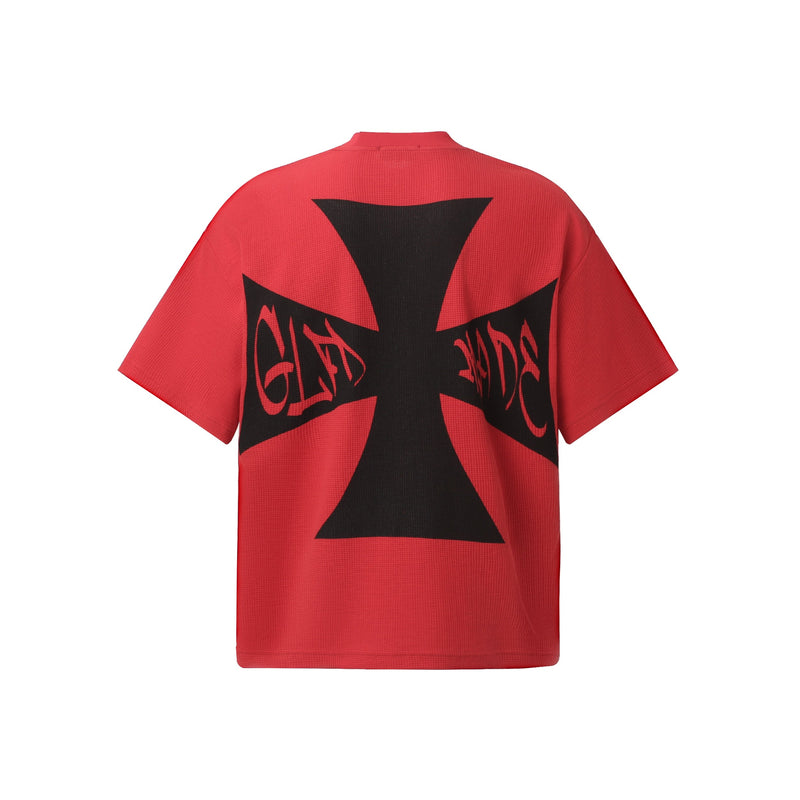 Red oversized graphic tee with black punk cross print and gothic lettering on the back