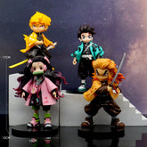 A 4-piece Demon Slayer figure set featuring Tanjiro, Nezuko, Zenitsu, and Rengoku stands on display against a galaxy backdrop. Each high-quality PVC collectible is dressed in unique outfits and striking poses, with each standing 17cm tall—the perfect anime gift.