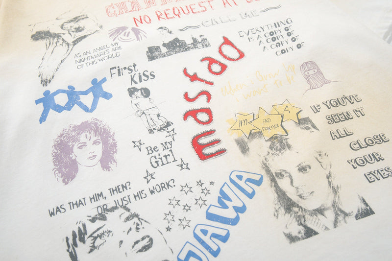 White graphic tee with retro collage prints, bold red mixed signals text, and vintage pop-art portraits throughout