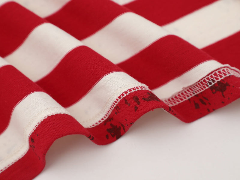 Close-up of cream tee sleeve hem with red and white stripes and overlocked edge