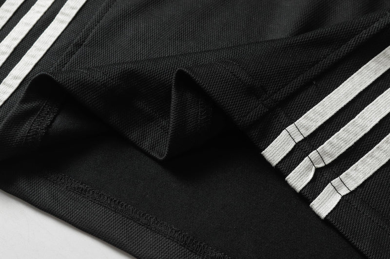 Black oversized V-neck street tee with white split stripes and textured sport graphic details