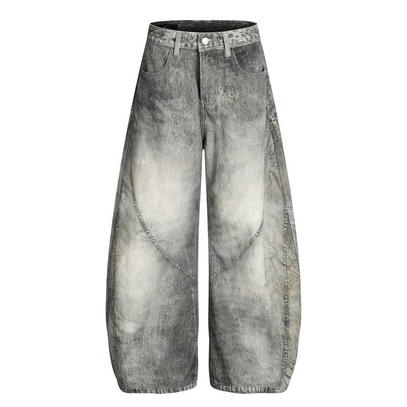 Washed curved barrel-leg denim pants with front pockets and wide legs