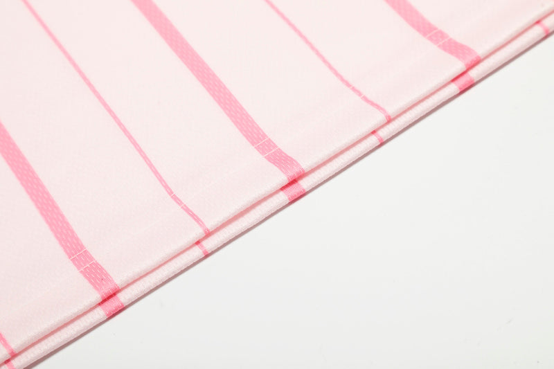 Close-up of pink pinstripe jersey hem with stitched edge