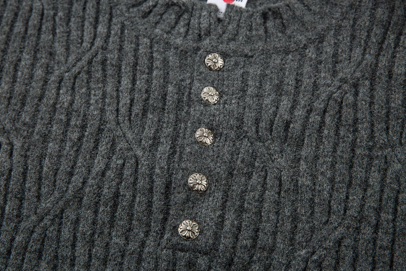 Close-up of charcoal gray henley placket with four floral buttons