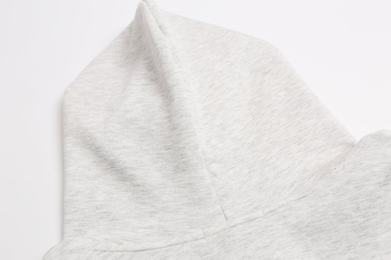 Close-up of light gray hoodie hood in heathered fabric