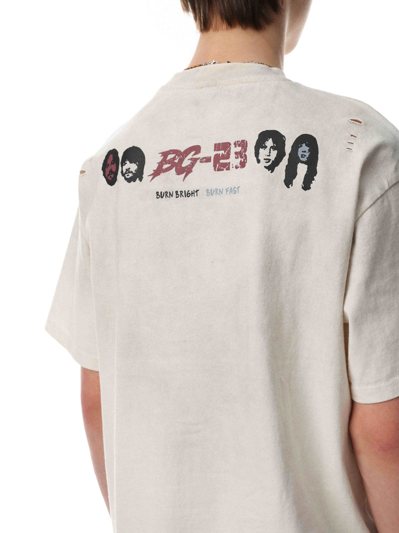 Cream vintage distressed band tee with back graphic, ripped shoulder details, and bold Burn Bright Burn Fast print