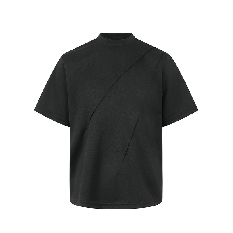 Black oversized tee with asymmetric diagonal seam and short sleeves, featuring a minimalist streetwear silhouette