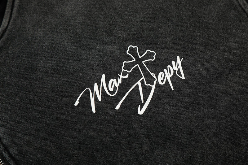 Close-up of white script logo print on black hoodie chest
