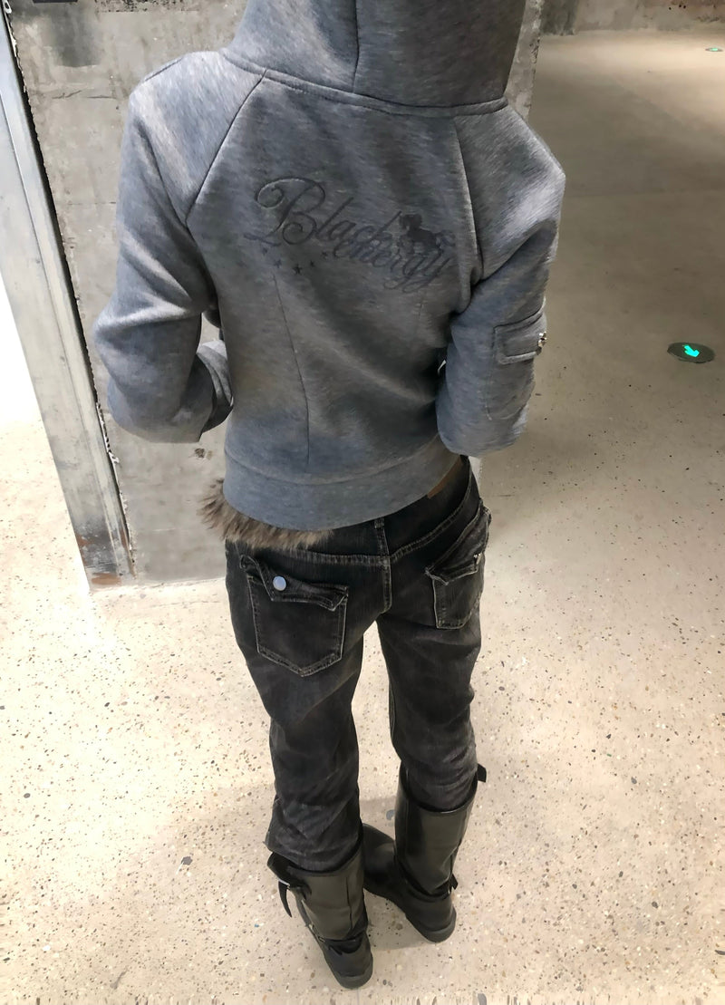 Back of grey hoodie with embroidered script detail