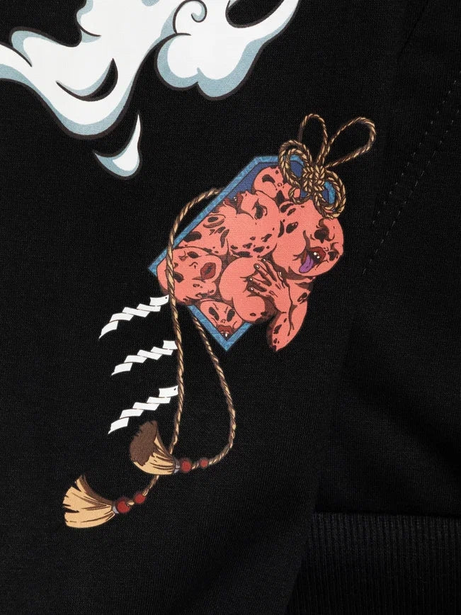 The Jujutsu Kaisen Geto Suguru Anime Hoodie showcases a cloud and small round figure with multiple faces tied by a rope, using bold outlines and bright colors on a dark background.