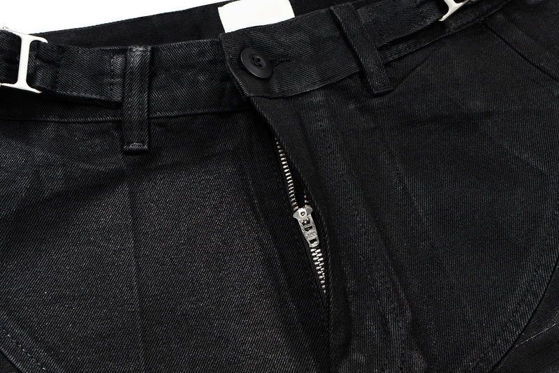 Close-up of black pants waistband with button and front zipper detail