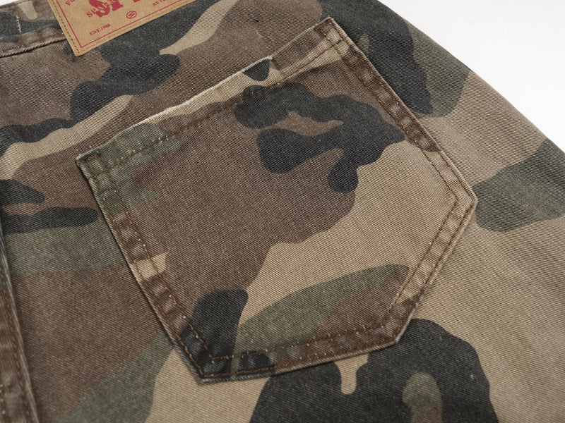Close-up of back pocket on camo shorts with angled flap and stitched trim