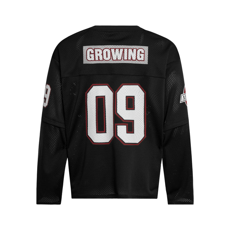 Black mesh hockey jersey back with large white 09 and GROWING patch
