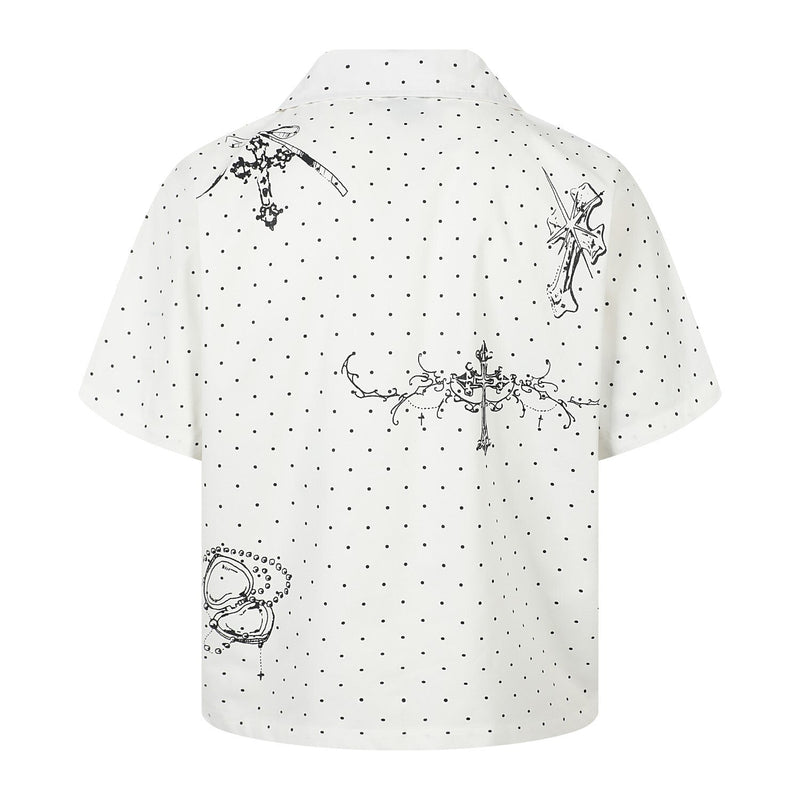 White polka dot shirt with black cross graphics, back view