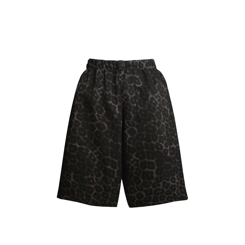 Back view of black leopard print loose shorts with a patch pocket