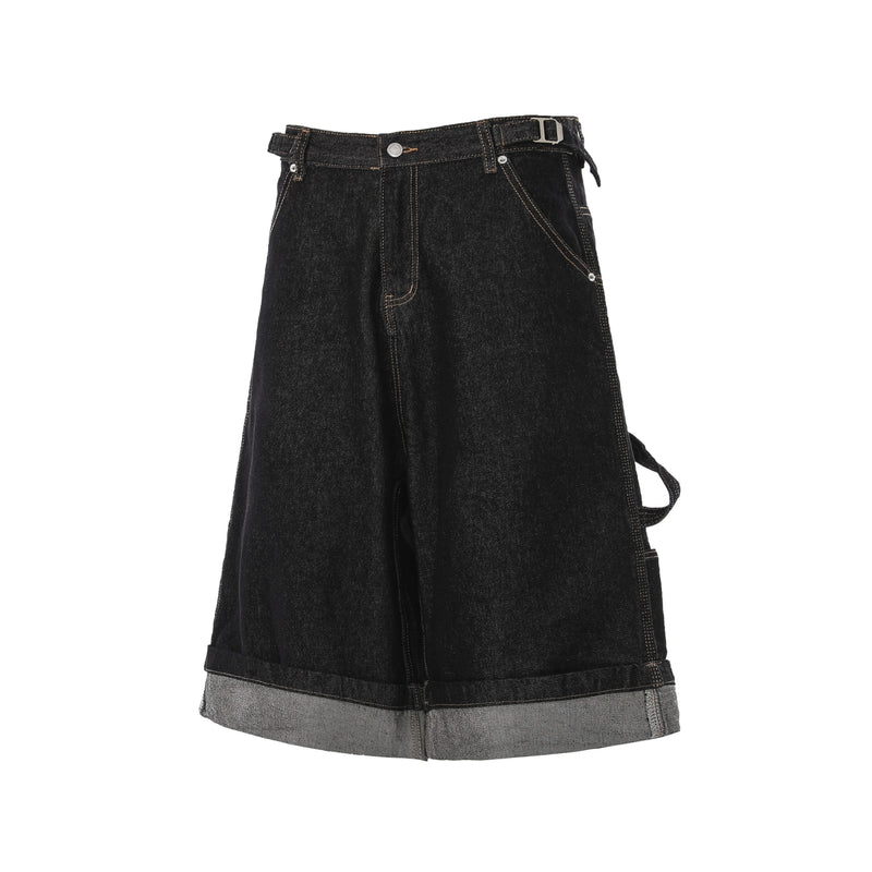 Front view of black denim cargo shorts showing left-side cargo strap and buckle