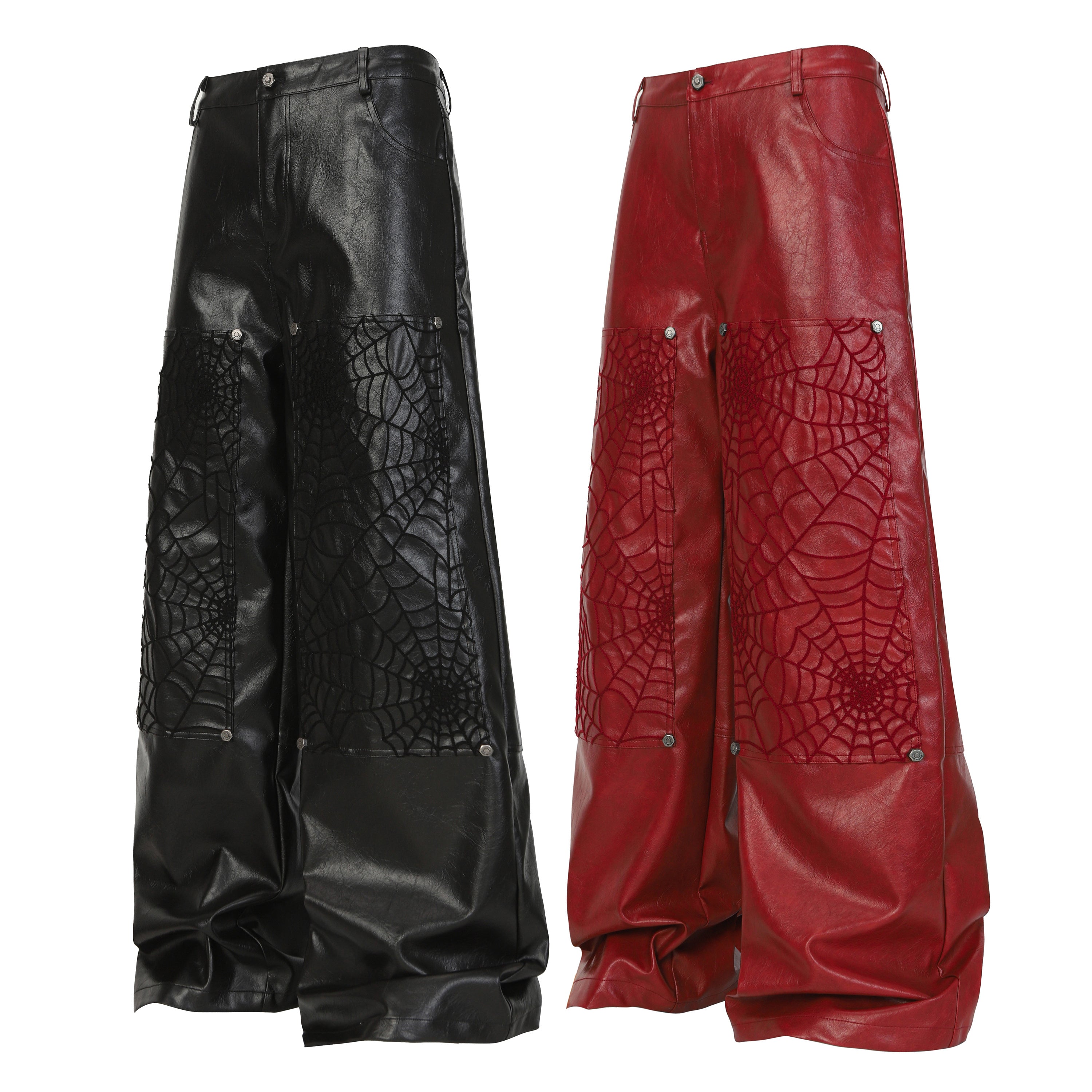 Black and red faux leather wide-leg pants with spider-web embossed panels and metal rivet accents, shown side by side