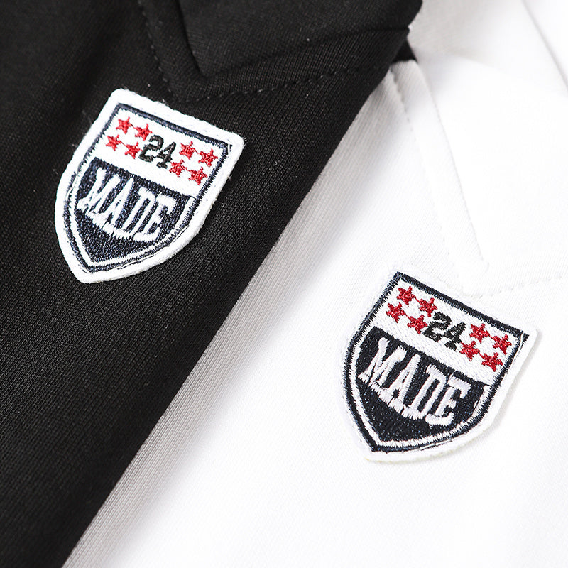 Black and white cotton jersey with diagonal stripe and MADE shield patches on the chest