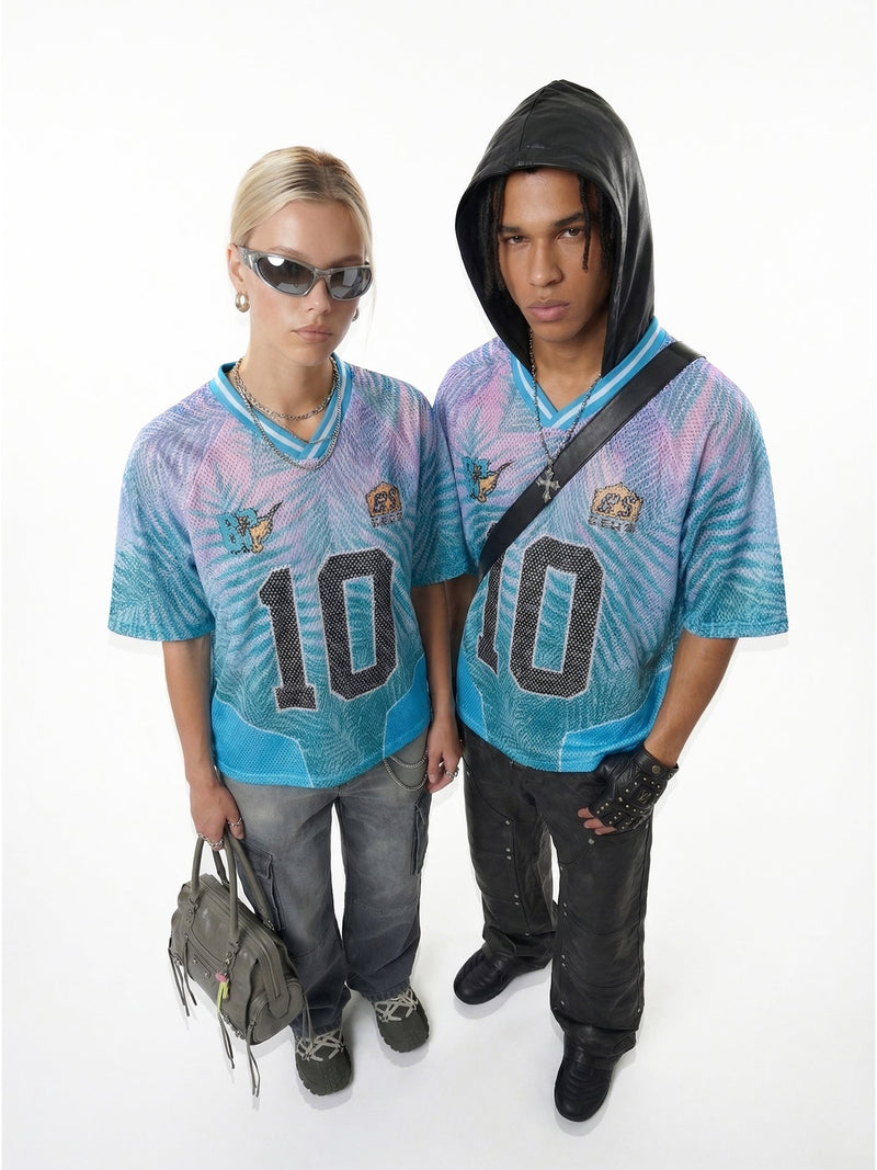 Two models wearing blue and pink Seakoff Tropical 10 mesh jersey T-shirts with oversized number 10 graphics