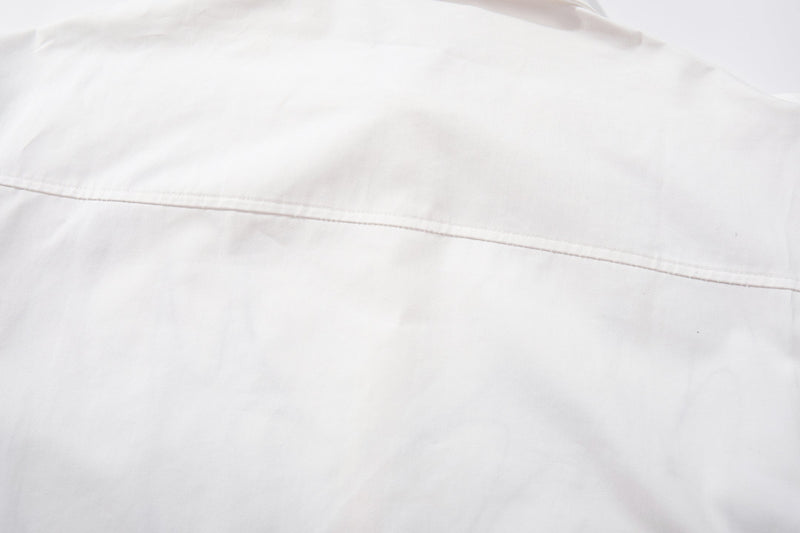 Close-up of white shirt back yoke seam