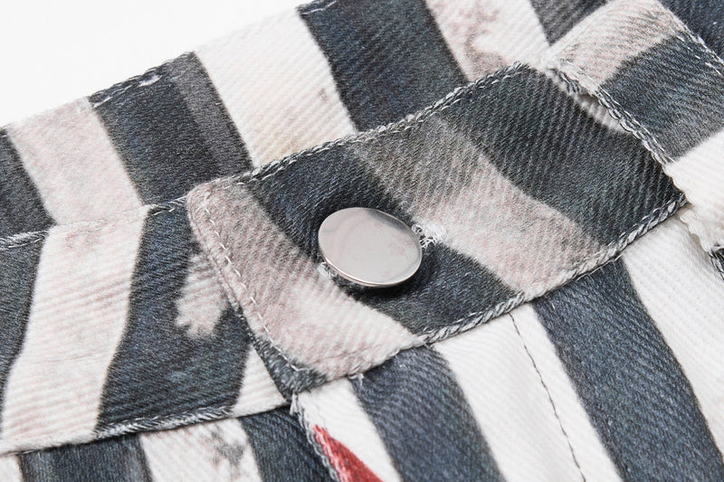 Close-up of striped fabric layer with snap button detail on the waistband