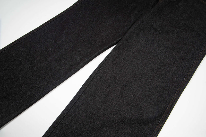 Wide-leg dark wash denim pant legs laid flat with seam detail