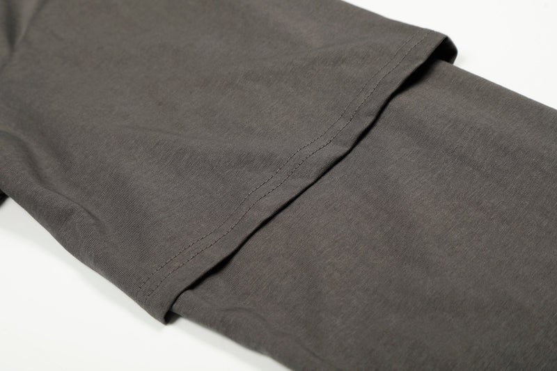 Close-up of long sleeve cuff on charcoal tee with double-stitched hem