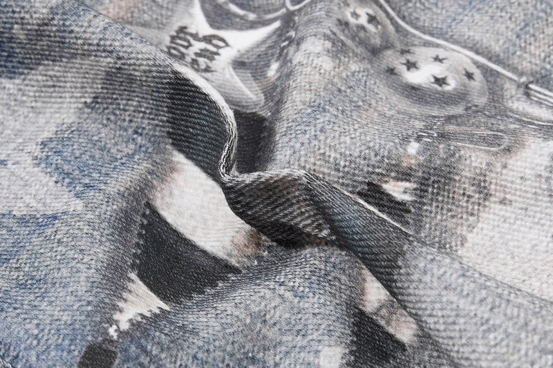 Close-up of gathered denim fabric with star print and textured weave
