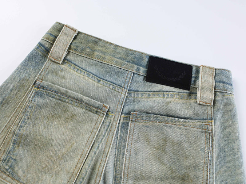 Back waistband and patch pockets on faded blue wide leg jeans with black label patch