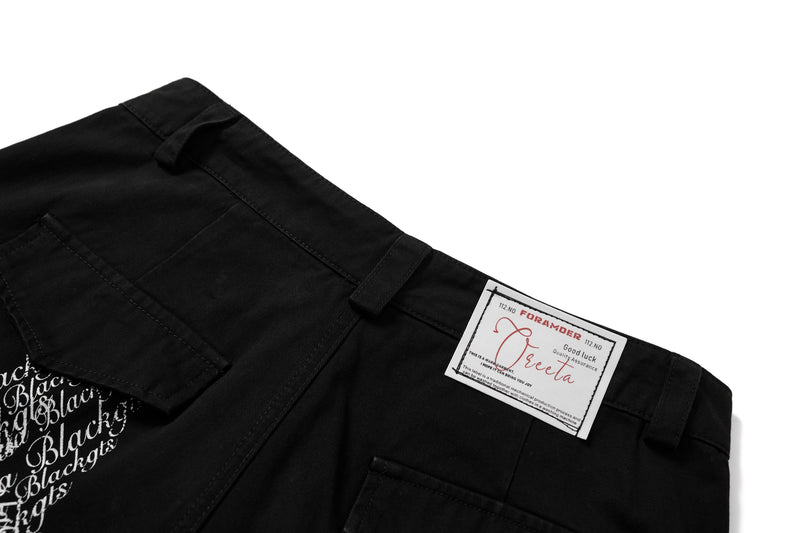 Close-up of back waistband with label patch on black cargo pants