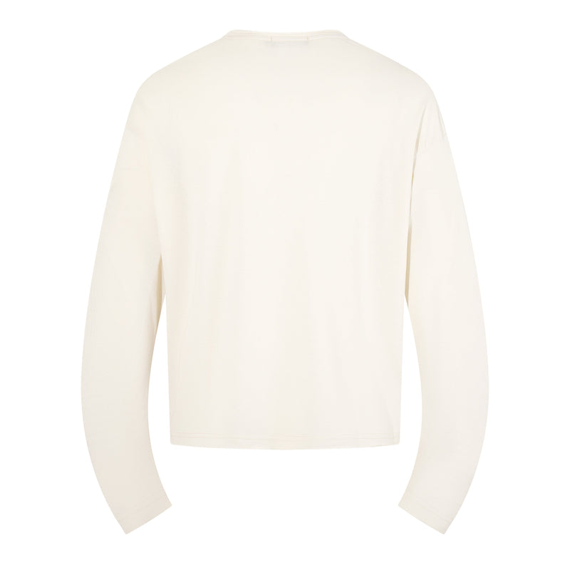 Back view of cream long sleeve tee with plain solid finish
