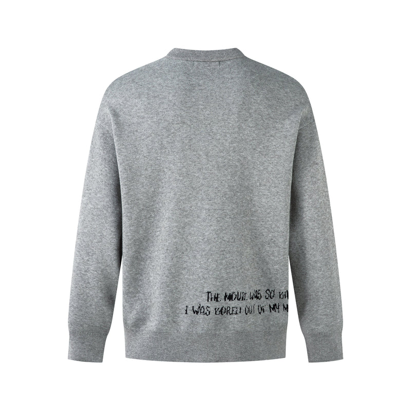 Back view of gray knit sweater with plain surface and small black text graphic near the lower hem