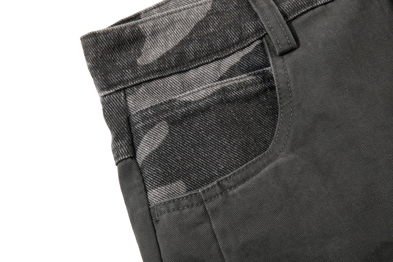 Close-up of black camo side pocket and waistband detail