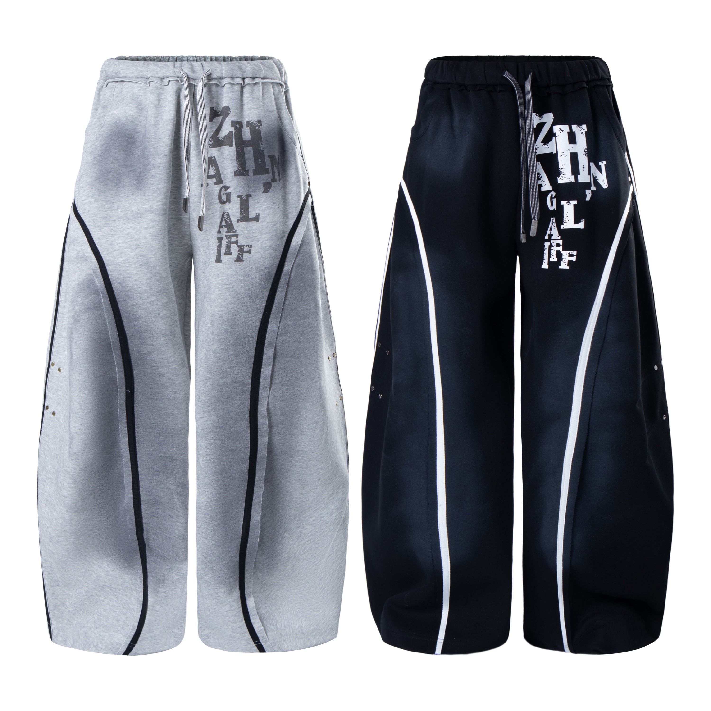 Omirad curved panel sweatpants in heather grey and navy, front view showing bold typography graphic and contrast stripe seams