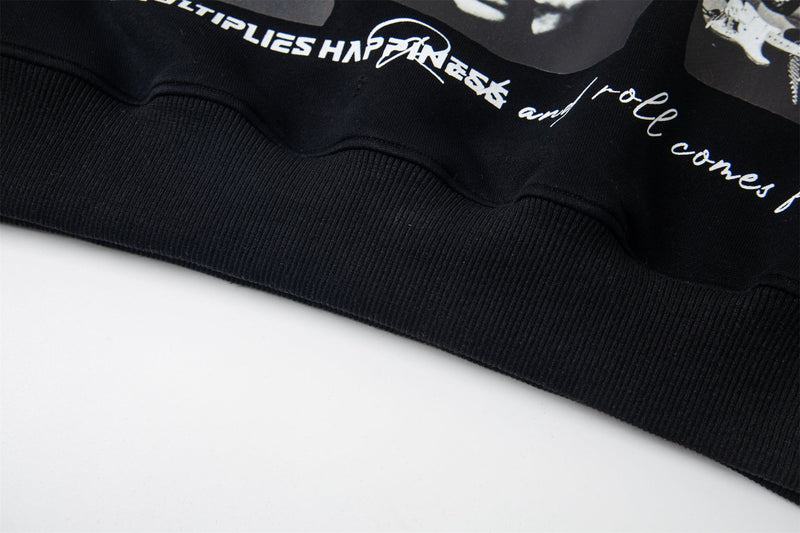 Close-up of black hoodie ribbed hem and lower print detail