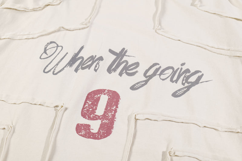 Front graphic close-up on cream long sleeve tee with gray script and red number 9