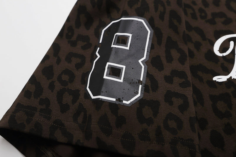 Leopard print graphic tee with oversized varsity number 8 on dark brown streetwear T-shirt fabric