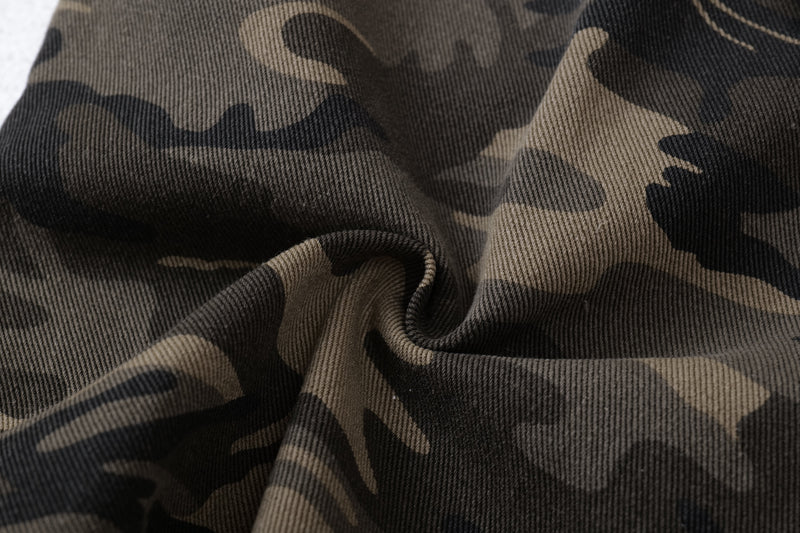 Close-up of camo fabric texture with gathered fold