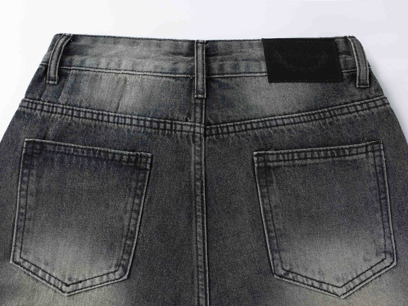 Back waistband and pocket view of black wide-leg jeans with faded wash