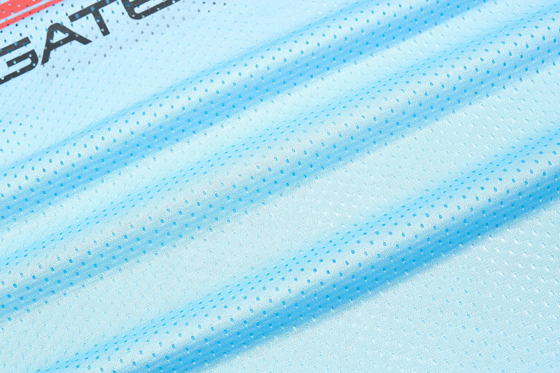 Light blue mesh sports jersey fabric with dotted texture and partial black Starline logo print