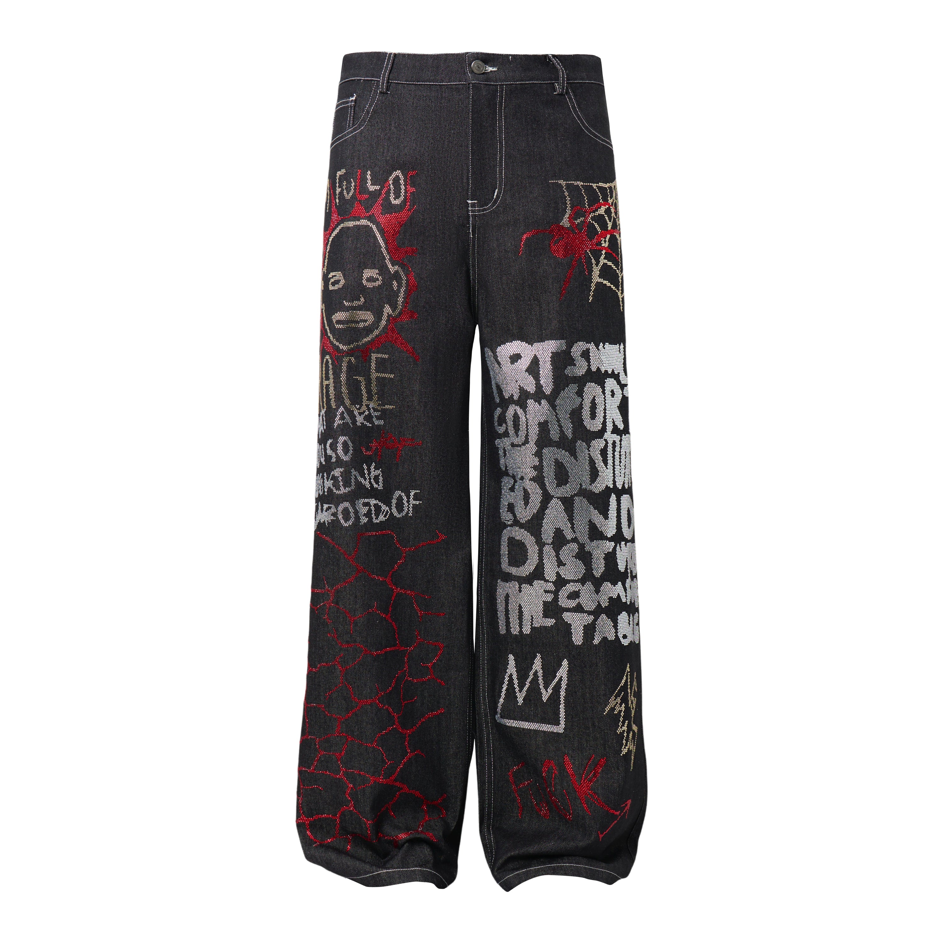 Front view of black wide-leg denim pants with graffiti-style embroidery including a face, spider web, and bold text graphics
