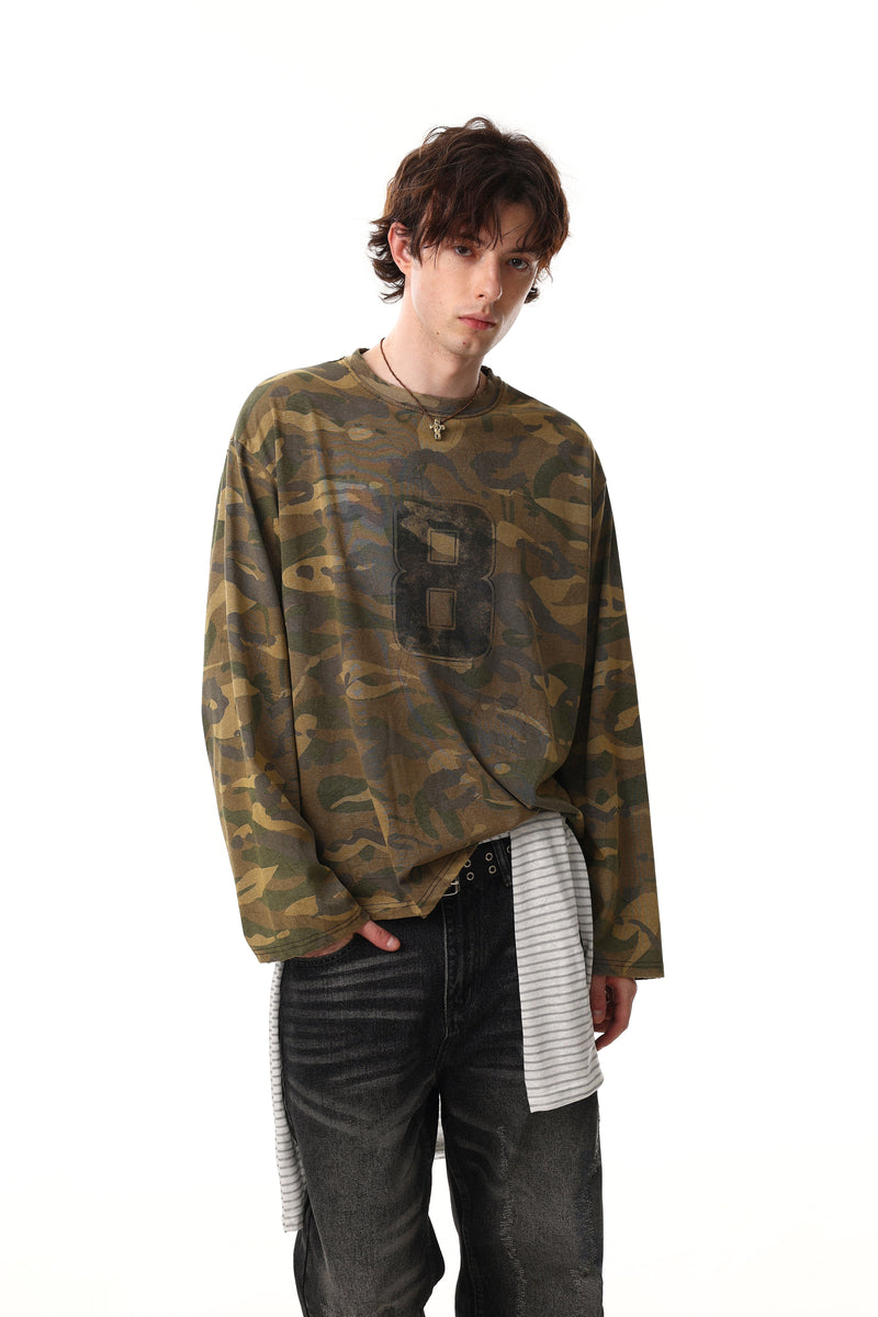 Model wearing faded camo long sleeve tee with large number 8 graphic