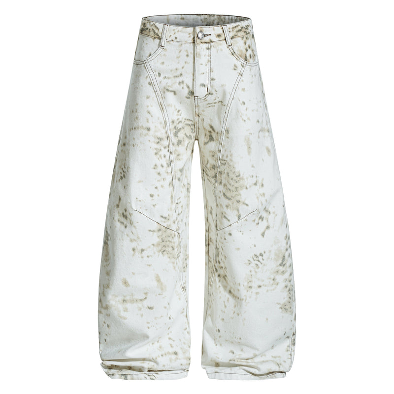 Front view of white wide leg jeans with vintage splatter wash and curved seam detail