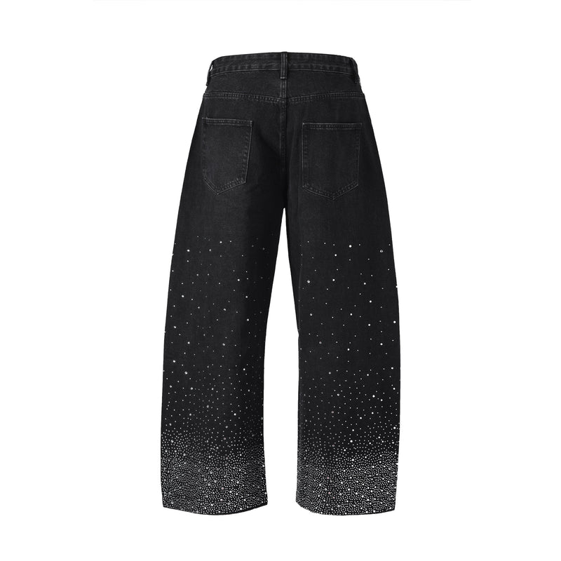 Back view of black wide-leg denim jeans with rhinestone burst detail near the hems
