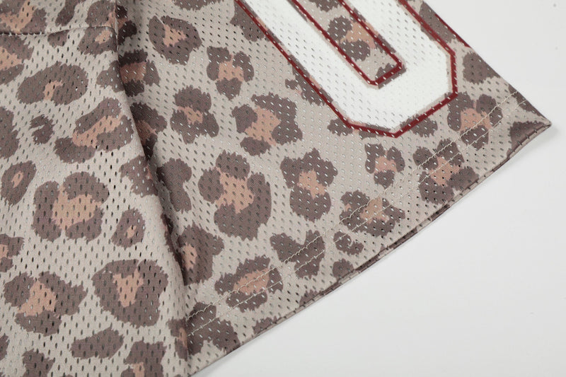 Leopard print mesh varsity jersey sleeve with red outlined number and stitched hem detail