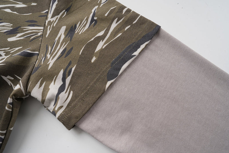 Left sleeve detail on olive camo long sleeve tee with gray layered cuff