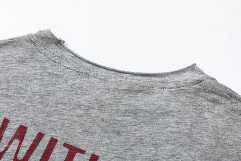 Close-up of gray crew neck collar with visible stitching