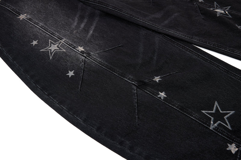 Close-up of star-print denim leg with angled seam detailing